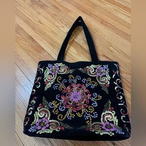 Black corduroy bag with decorative detail